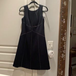 Size 6 Navy Calvin Klein semi-formal dress with stitching. Great for weddings.